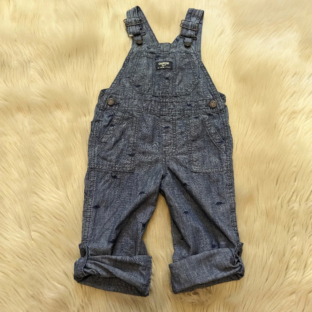 Oshkosh B'gosh blue overalls with navy blue dinosaur print size 2T